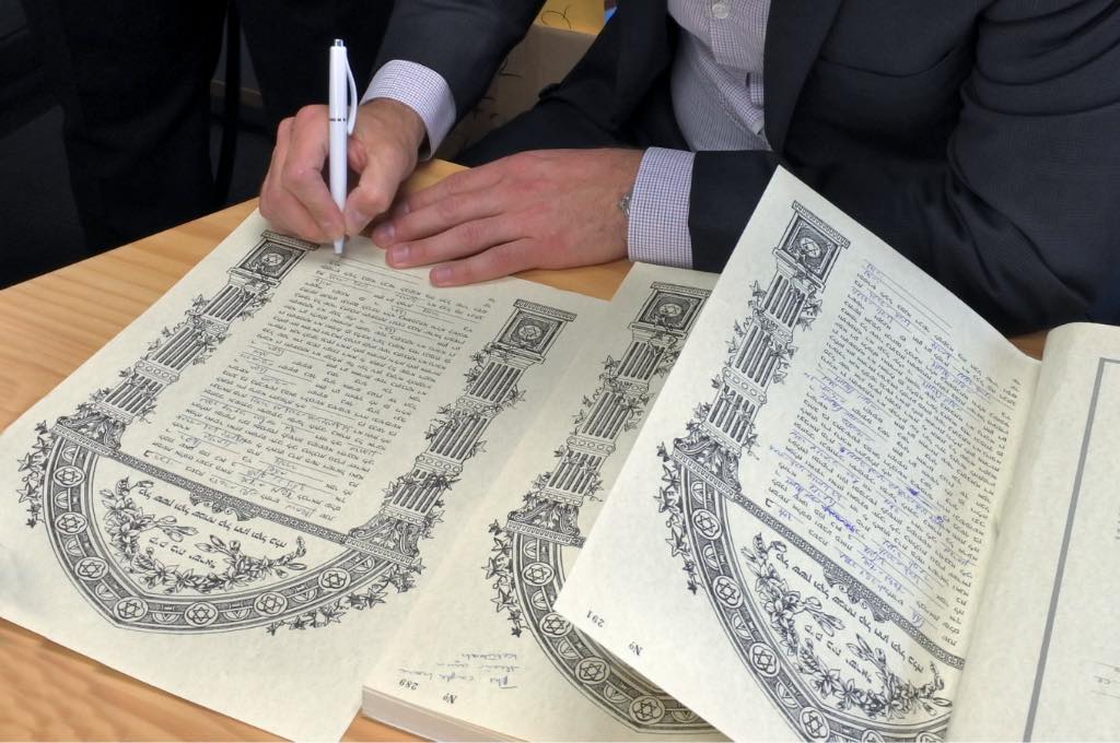 signing a ketubah